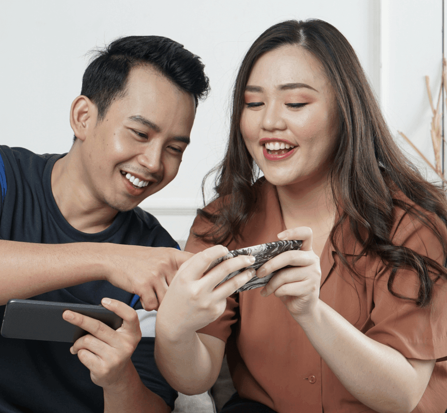 Two people looking at phone